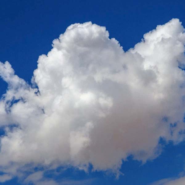image of a puffy cloud in a blue sky