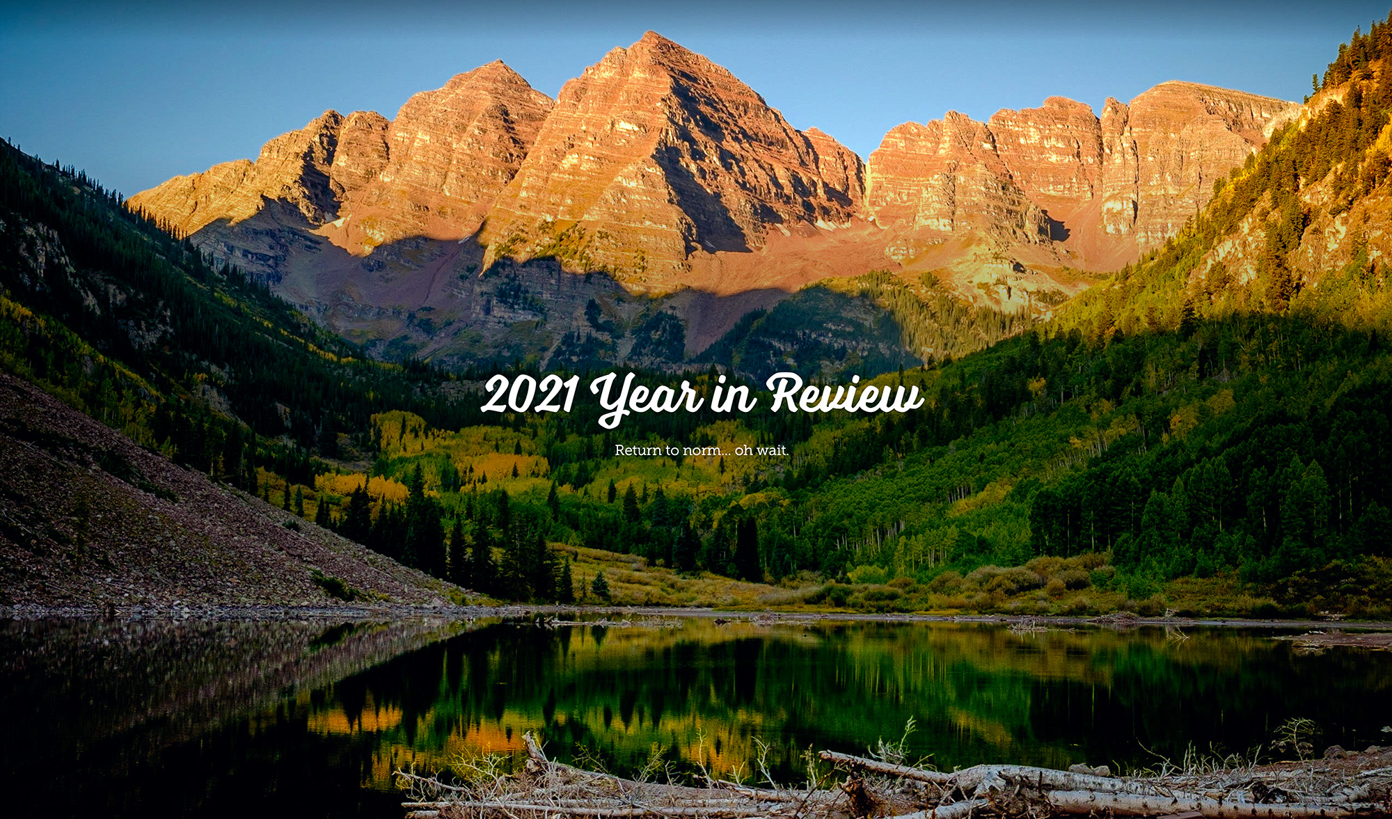 2021 year in review image of maroon bells colorado with sunrise light on the mountain peaks